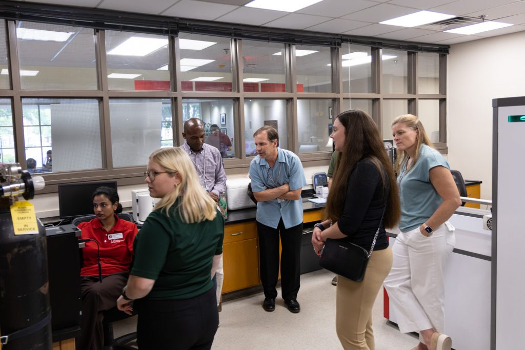 researchers in an instrument demo
