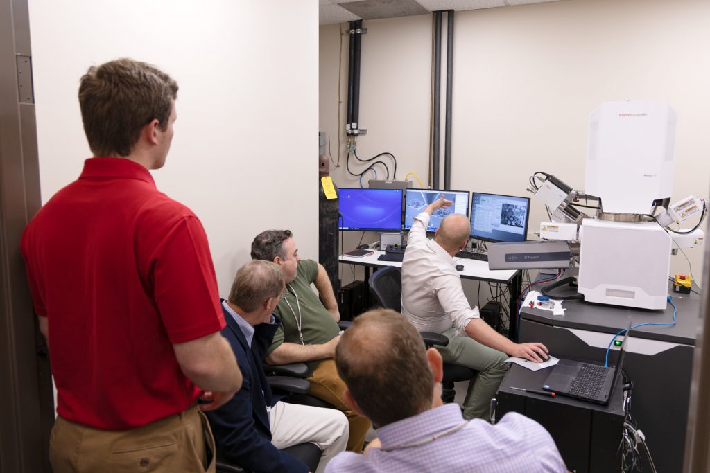 researchers in an instrument demo